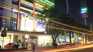A hotel with a prominent sign advertising 'GO HOTELS OTS. MANILA' and a website address. - Go Hotels Otis - Manila (Manila)