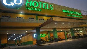 A hotel with a prominent 'Go Hotels Tacloban' sign, featuring a website URL and a tagline. - Go Hotels Tacloban (Tacloban)