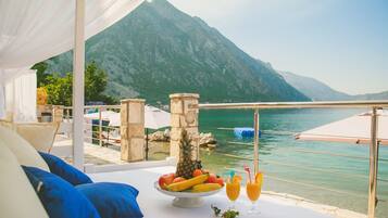 On the beach, sun loungers, beach umbrellas