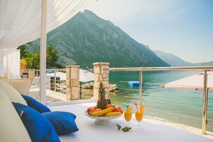 On the beach, sun loungers, beach umbrellas