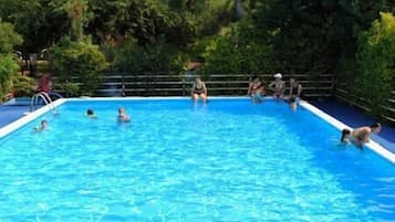 Seasonal outdoor pool, pool loungers