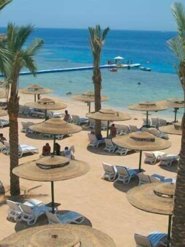 On the beach, sun-loungers, beach umbrellas, beach towels