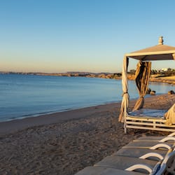 On the beach, sun-loungers, beach umbrellas, beach towels