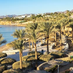 On the beach, sun-loungers, beach umbrellas, beach towels