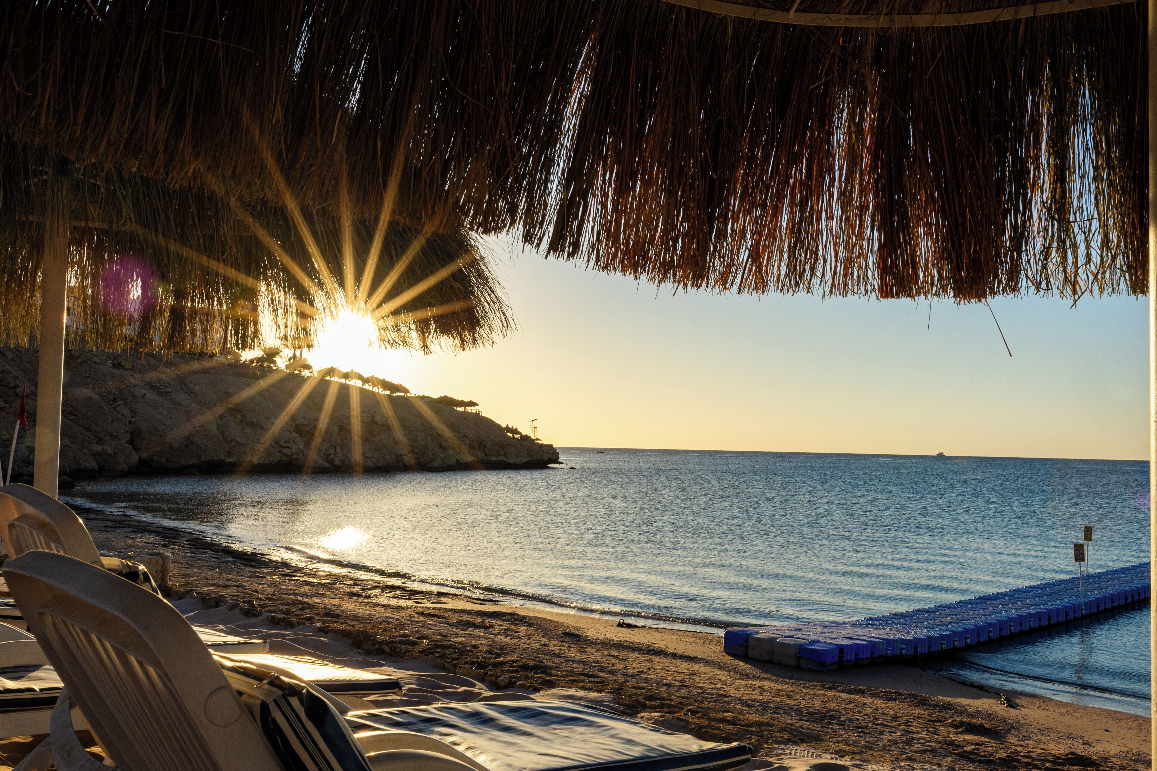 On the beach, sun loungers, beach umbrellas, beach towels
