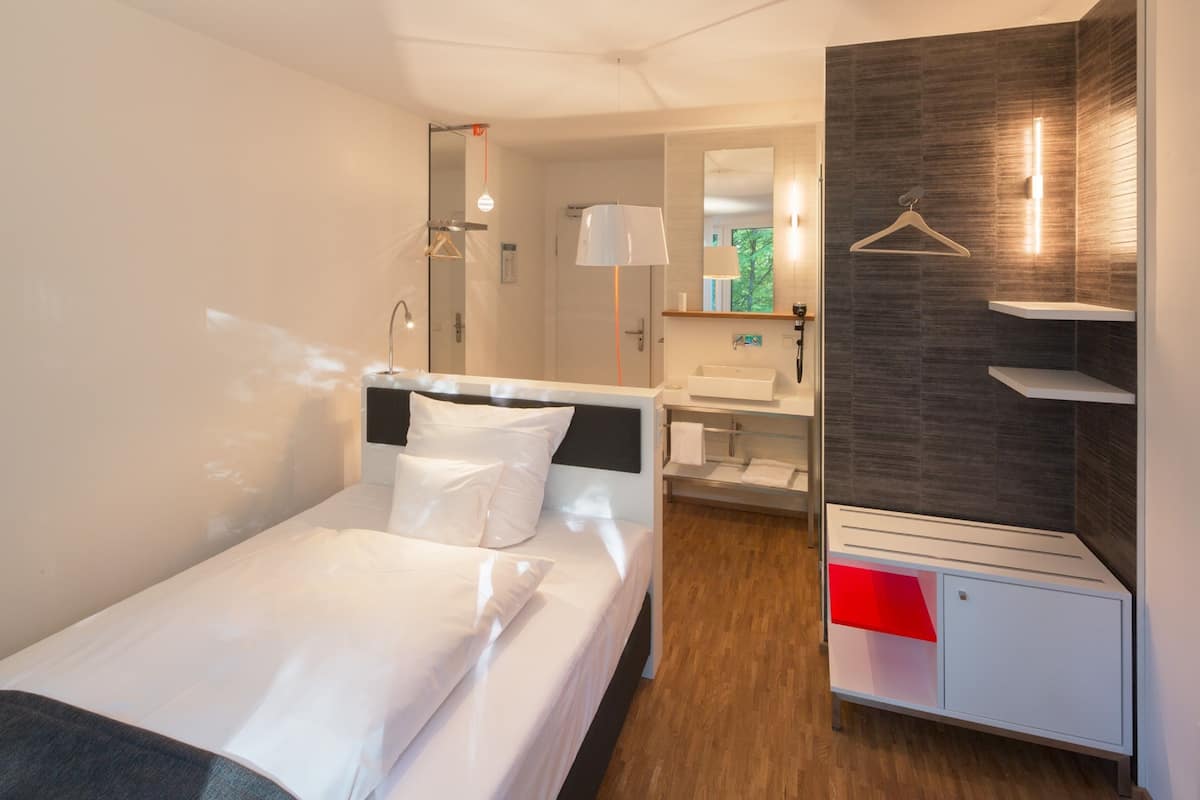 comfort single room, balcony, garden view | 1 bedroom, premium bedding, down duvets, free minibar