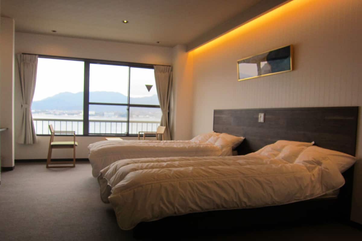 Deluxe Twin Room, Non Smoking, Sea View | Down comforters, desk, free WiFi, bed sheets