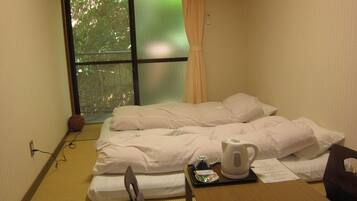 Economy Room, Non Smoking | Down comforters, desk, free WiFi, bed sheets