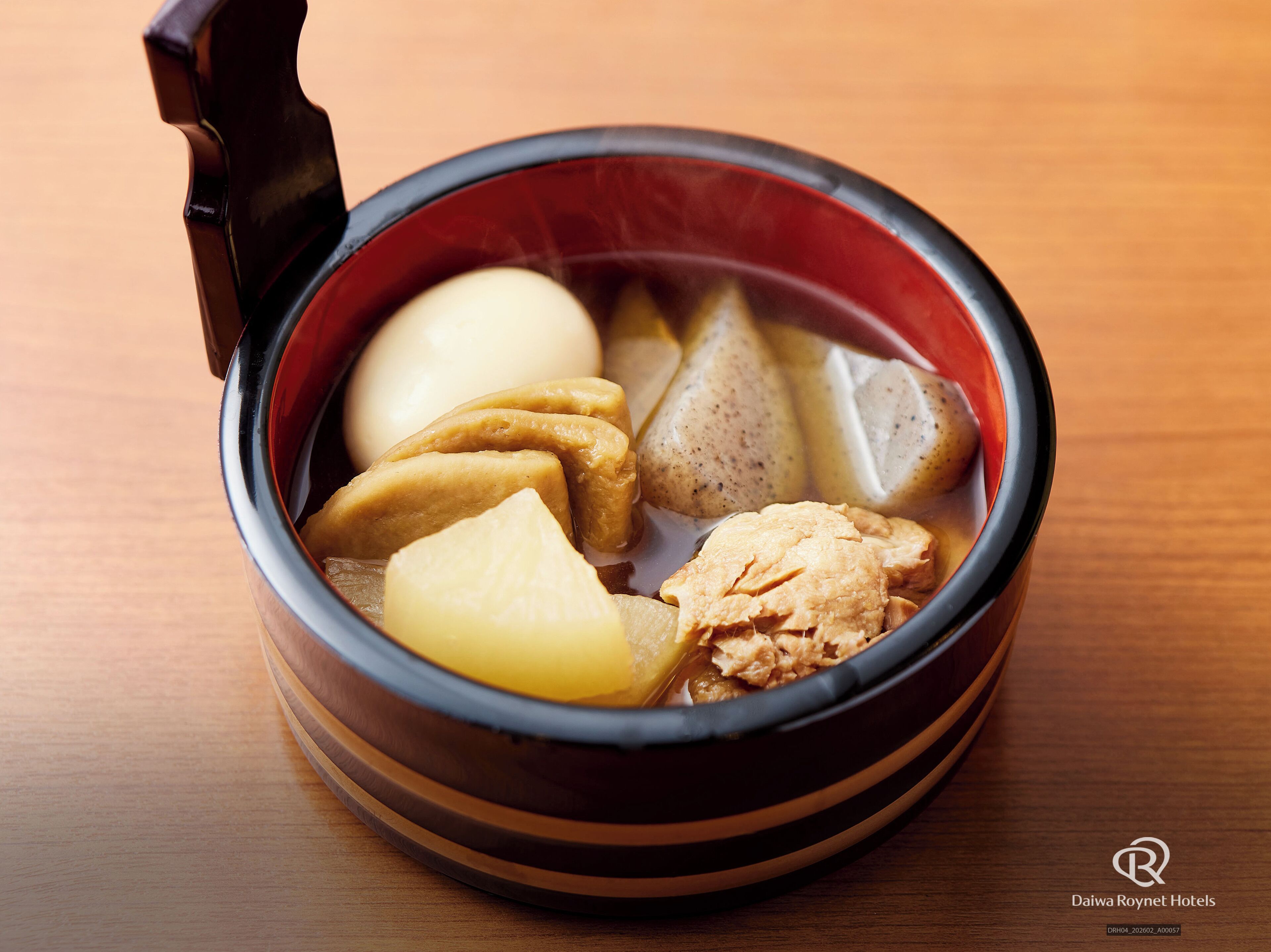 A traditional Japanese hot pot with various ingredients like tofu, fish, and vegetables.