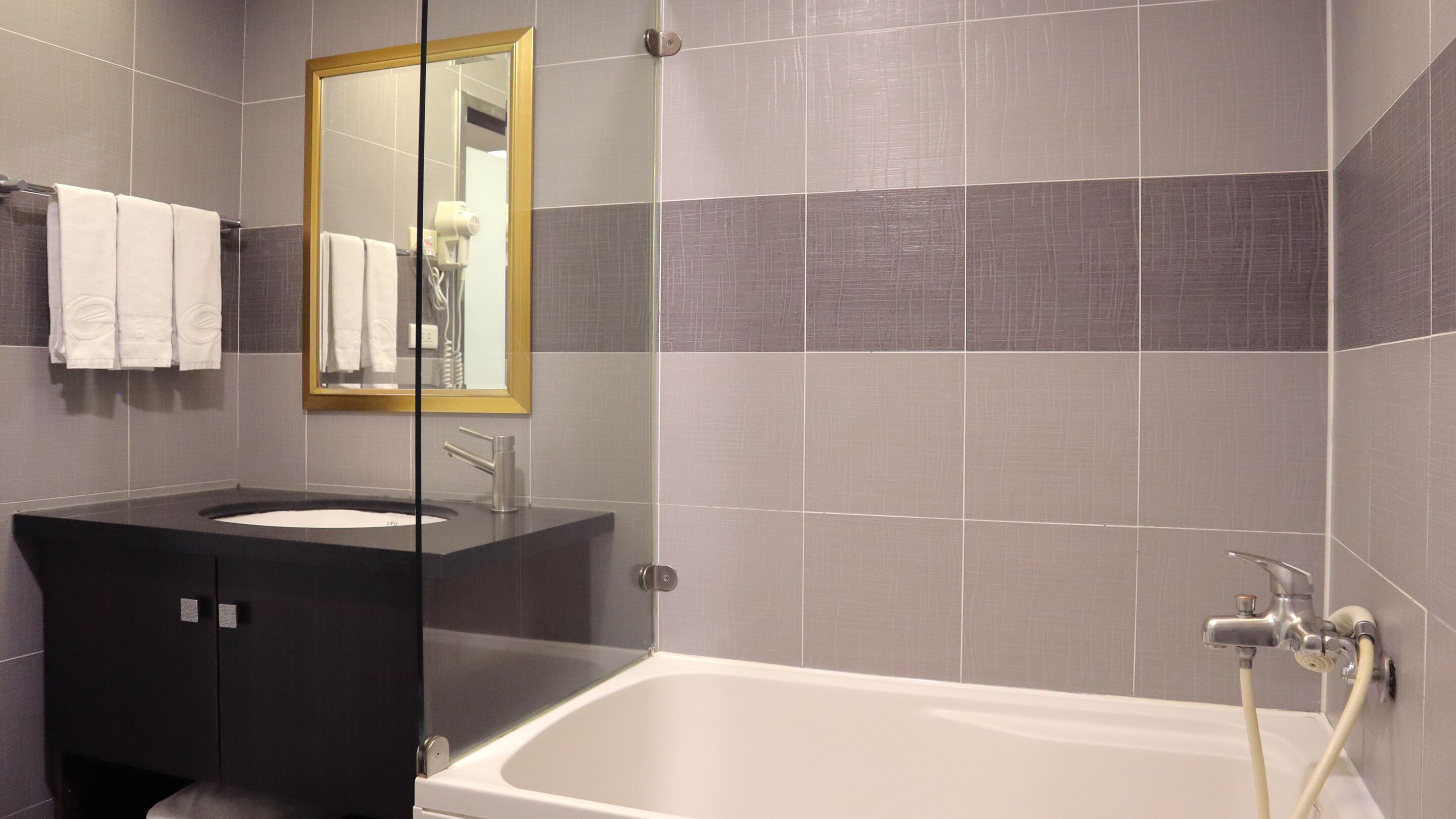 standard double room with extra bed | bathroom | shower, hair dryer, towels