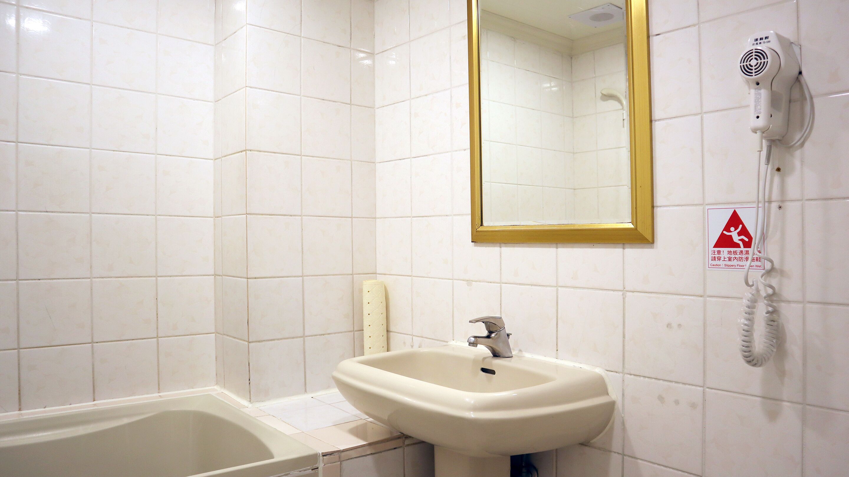 economy family room with bathtub | bathroom | shower, hair dryer, towels