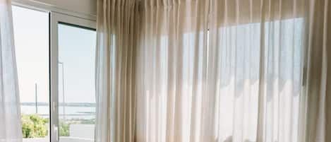 Apartment, 1 Bedroom, Lake View | Living area | Flat-screen TV
