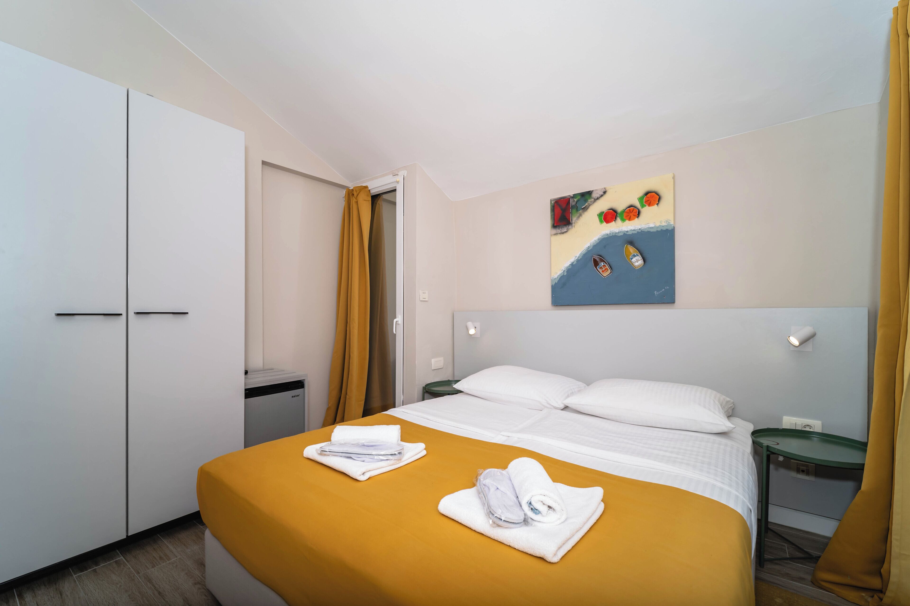 Quadruple Room with Sea View and Balcony | Minibar, in-room safe, desk, laptop workspace