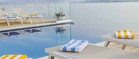 Seasonal outdoor pool, pool umbrellas, pool loungers