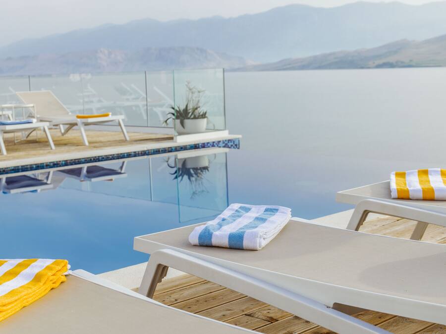 Seasonal outdoor pool, pool umbrellas, pool loungers