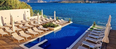 Seasonal outdoor pool, pool umbrellas, sun loungers