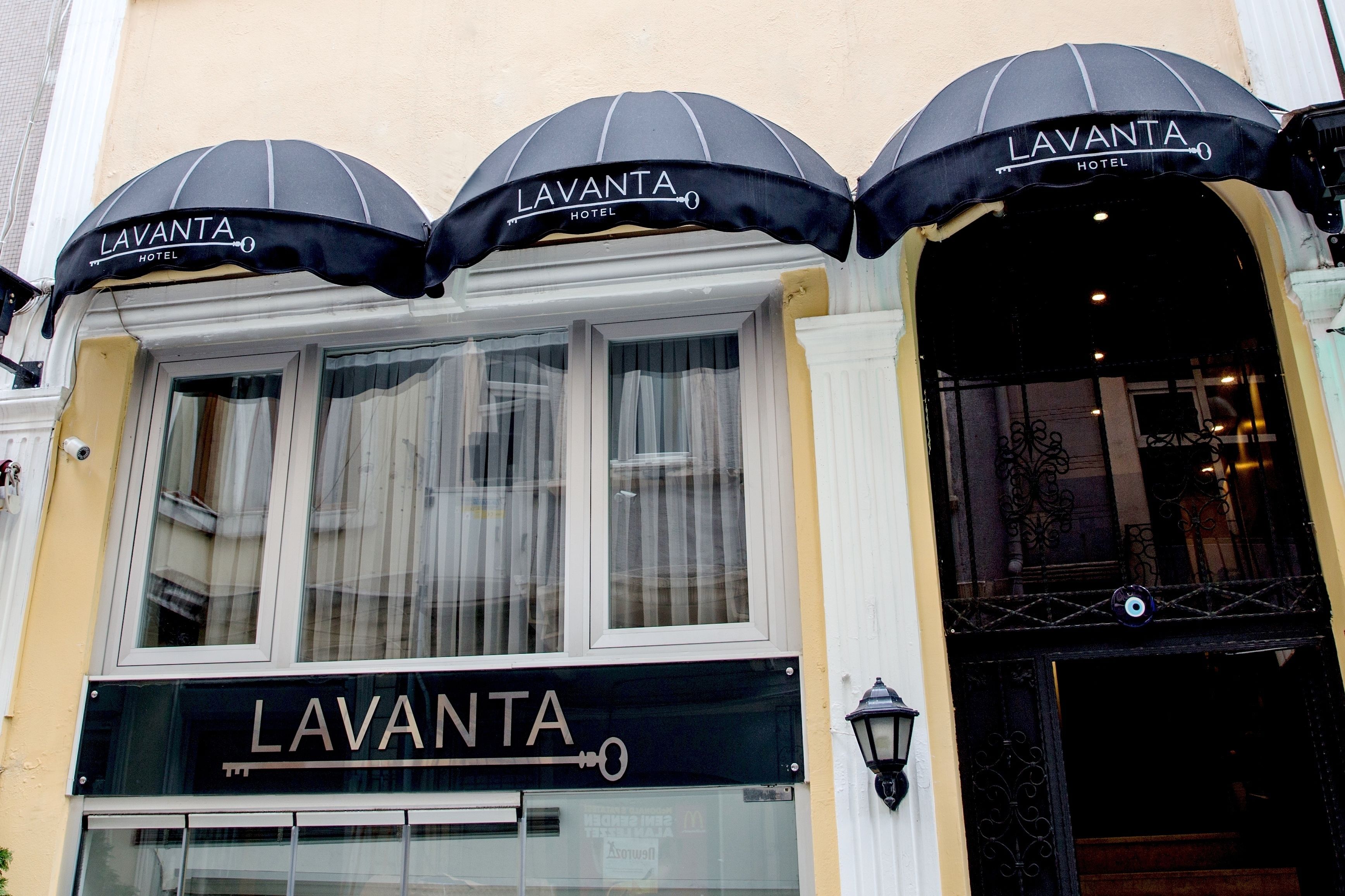 The exterior of the Lavanta Hotel with its name displayed on the awning and signage.