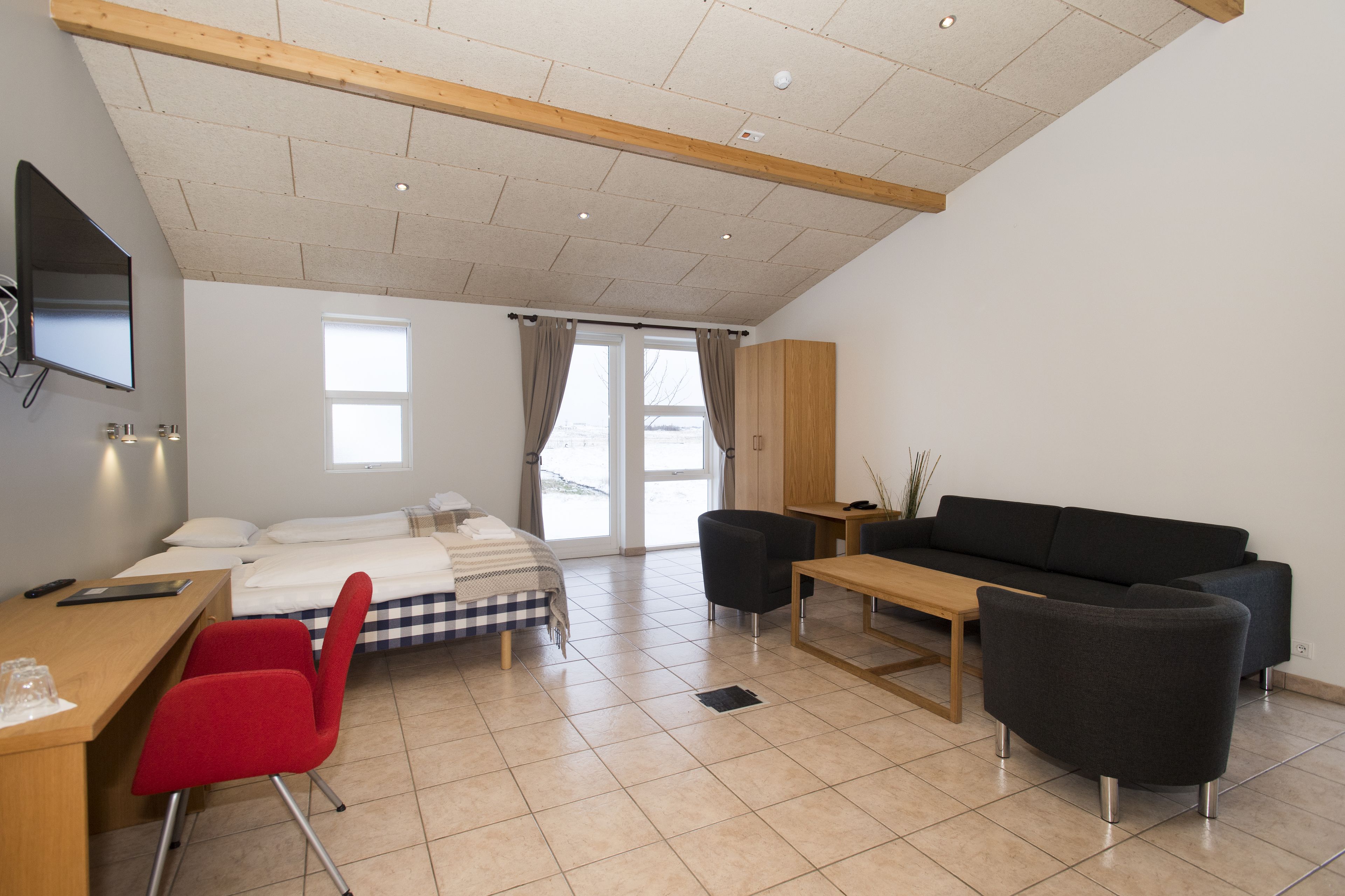 family room with hot tub access | living area | 150-cm flat-screen tv with satellite channels, tv