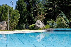 Seasonal outdoor pool, open 8:00 AM to 6:30 PM, pool loungers