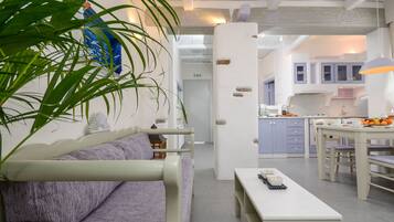 Grand Suite, 2 Bedrooms | Living room | Flat-screen TV, fireplace, DVD player