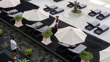 Outdoor pool, open 7:00 AM to 7:00 PM, pool umbrellas, sun loungers