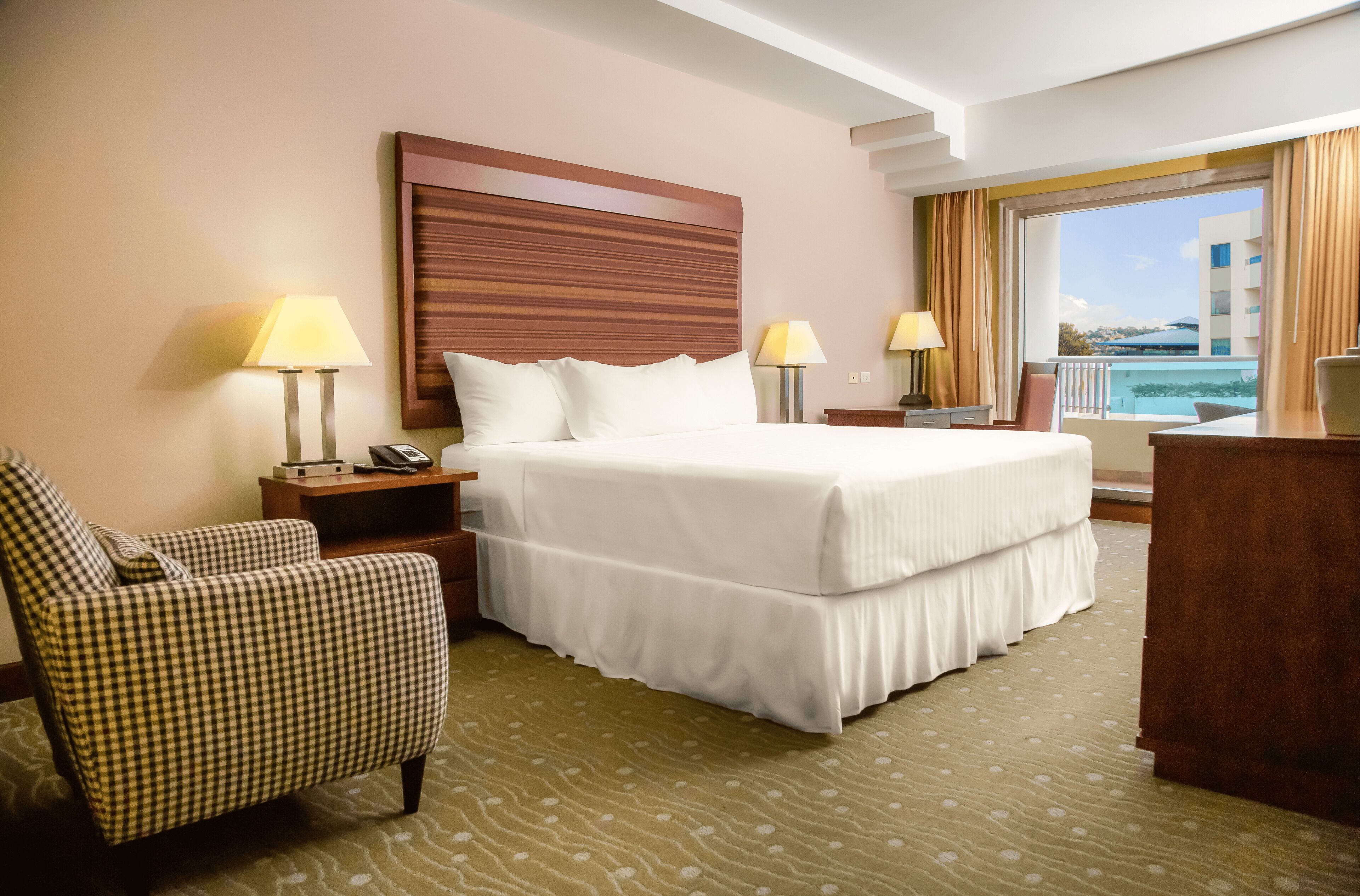 Premium bedding, down comforters, minibar, in-room safe