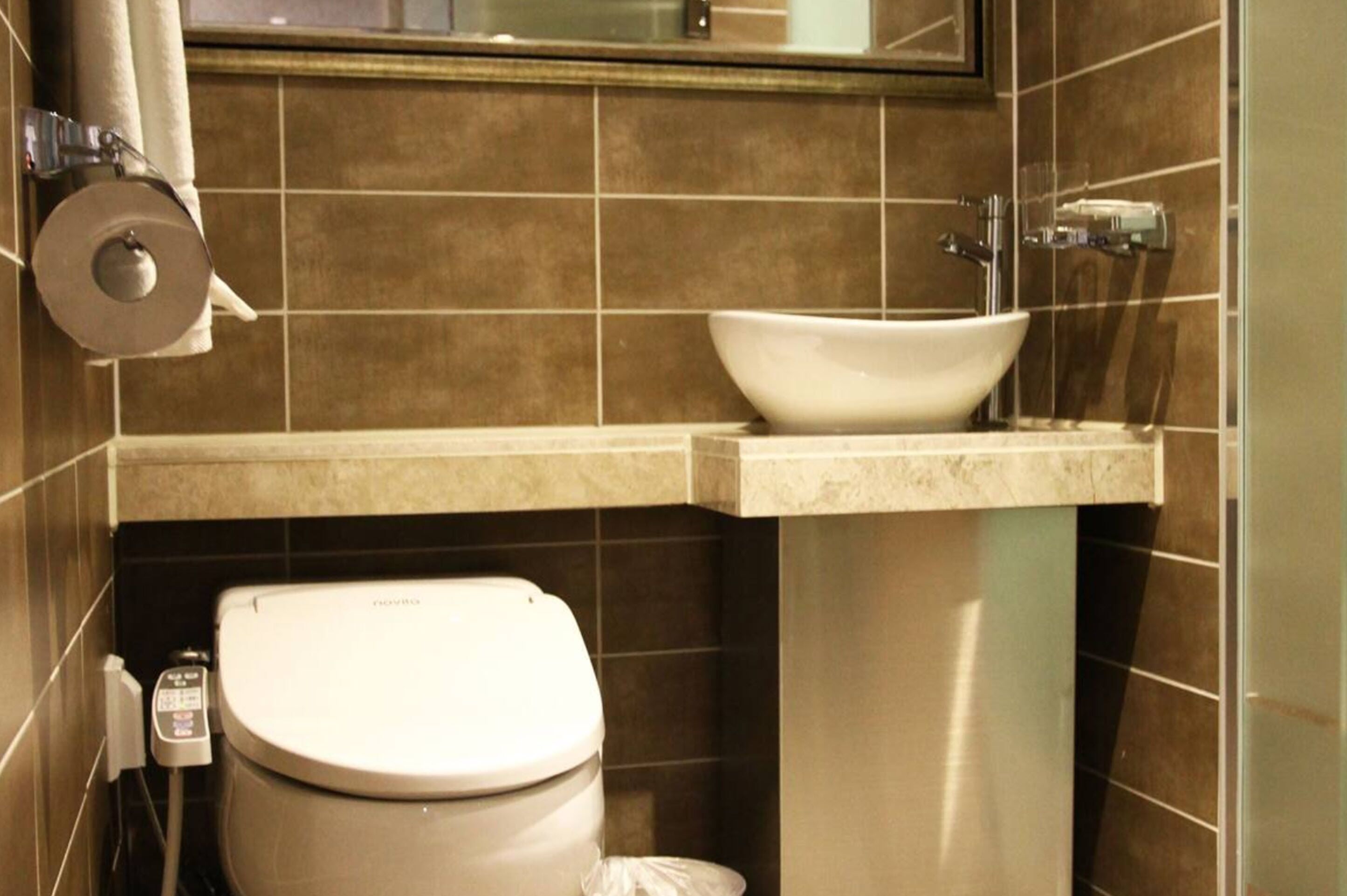 boutique deluxe room | bathroom | hair dryer, bathrobes, slippers, bidet