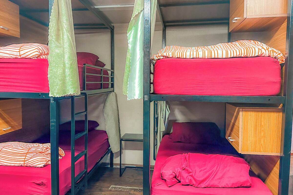 Premium bedding, desk, laptop workspace, soundproofing