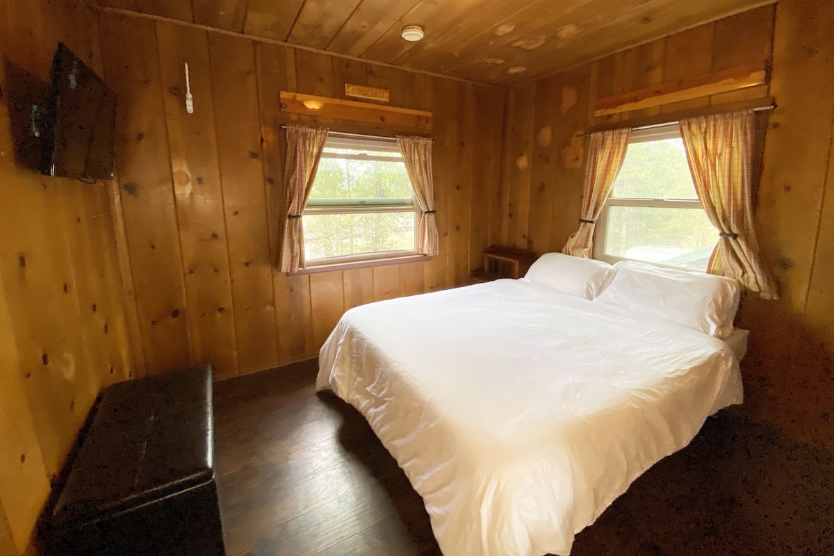 Premium bedding, desk, laptop workspace, soundproofing