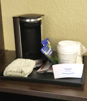 Enjoy a convenient in-room coffee station with a coffee maker, fresh towels, and a selection of snacks.
