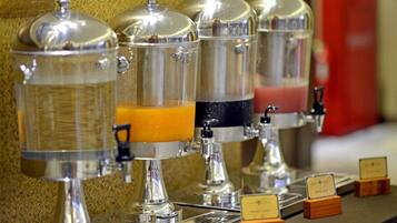 A coffee station with multiple dispensers, each with a different beverage option.