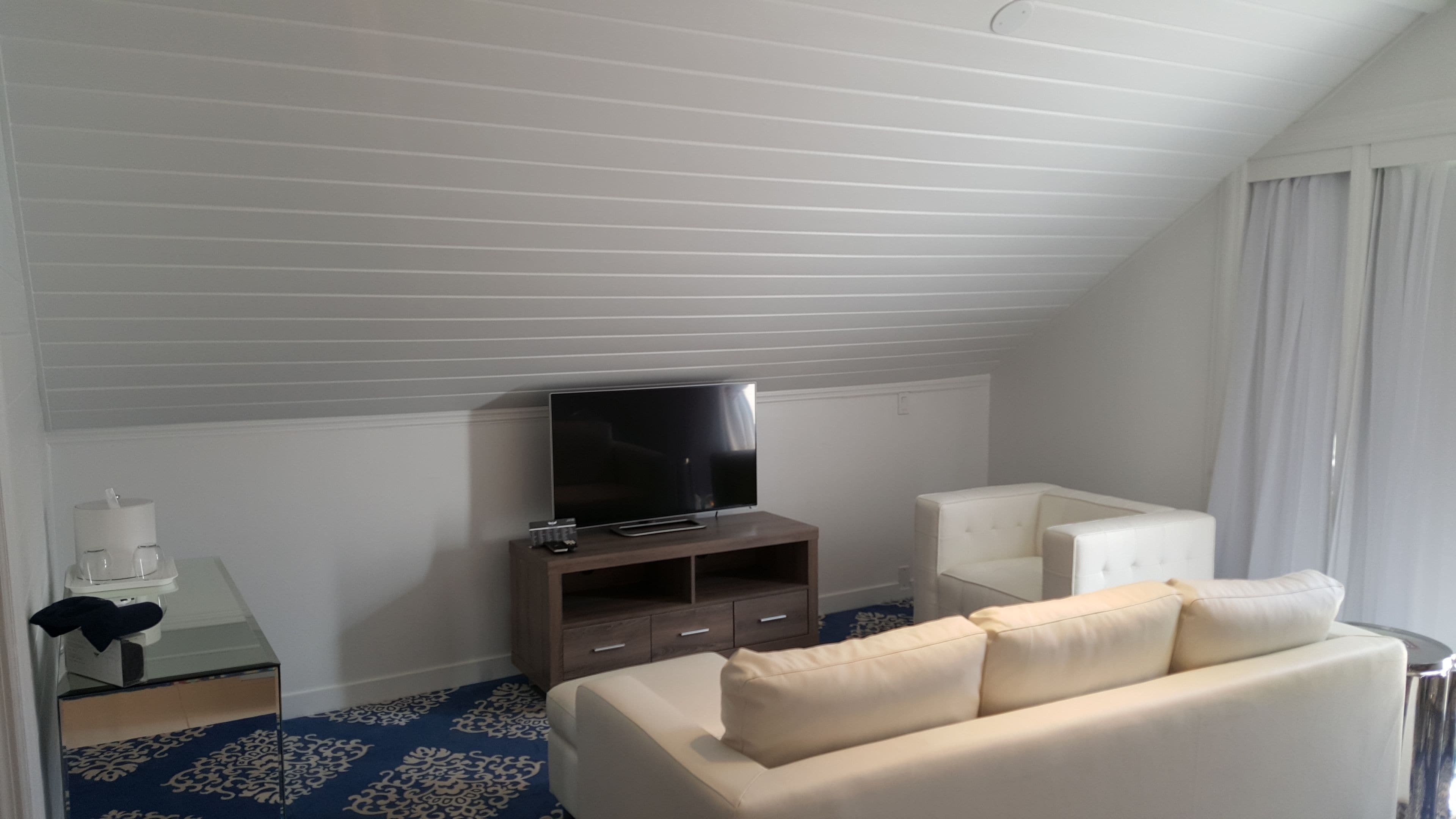 luxury king loft | living area | 42-inch lcd tv with digital channels, smart tv, netflix