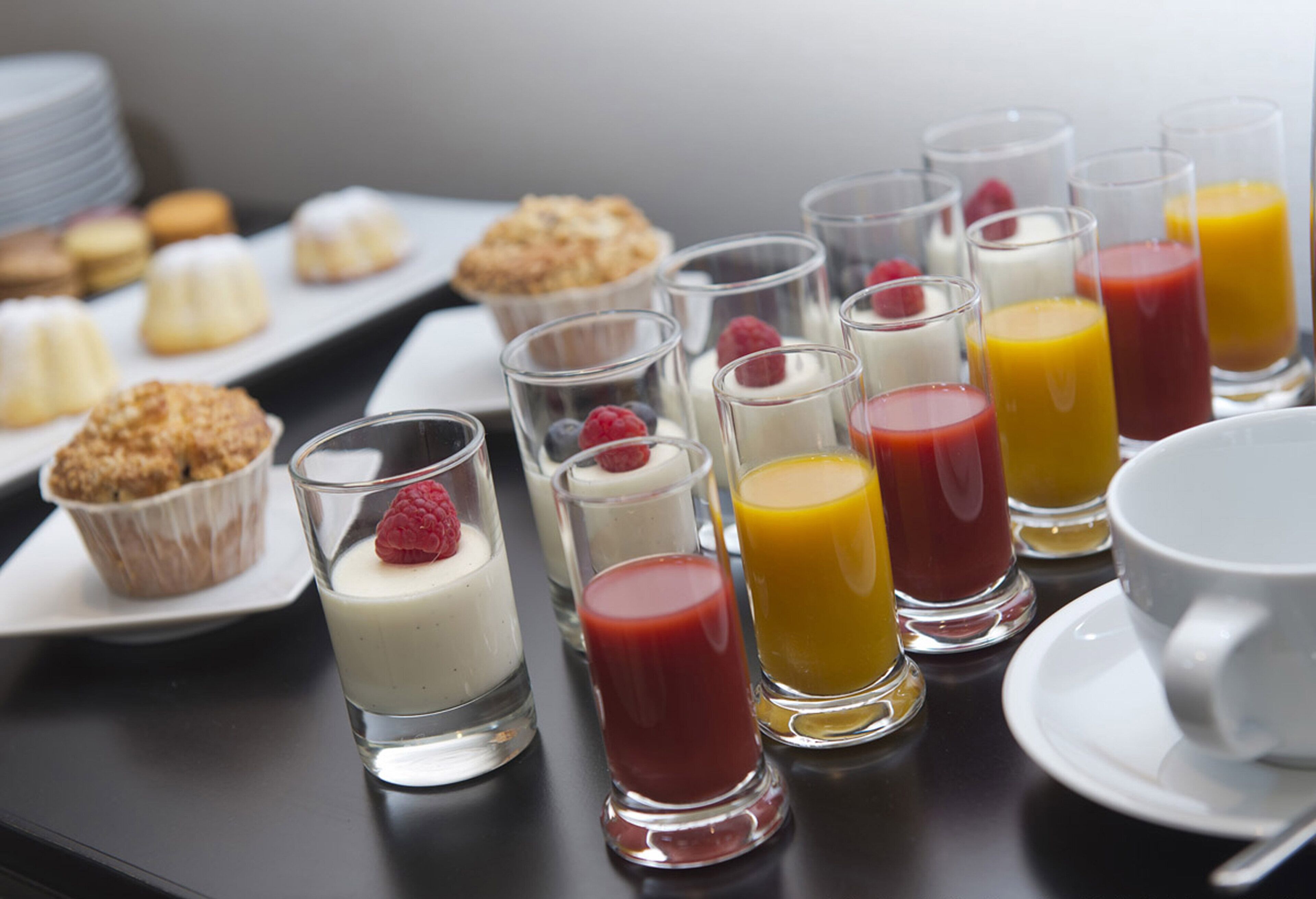 A breakfast buffet with various food items and beverages.