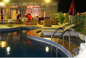 Indoor pool, pool umbrellas, pool loungers
