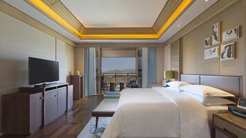Ambassador Suite, 1 Bedroom Larger Suite, 1 King, Balcony | Living area | 55-inch TV with digital channels, iPod dock, foosball