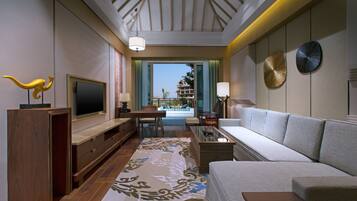 Premier Suite, 1 Bedroom Suite, 1 King, Garden view, Balcony | Living room | 55-inch TV with digital channels, iPod dock, foosball