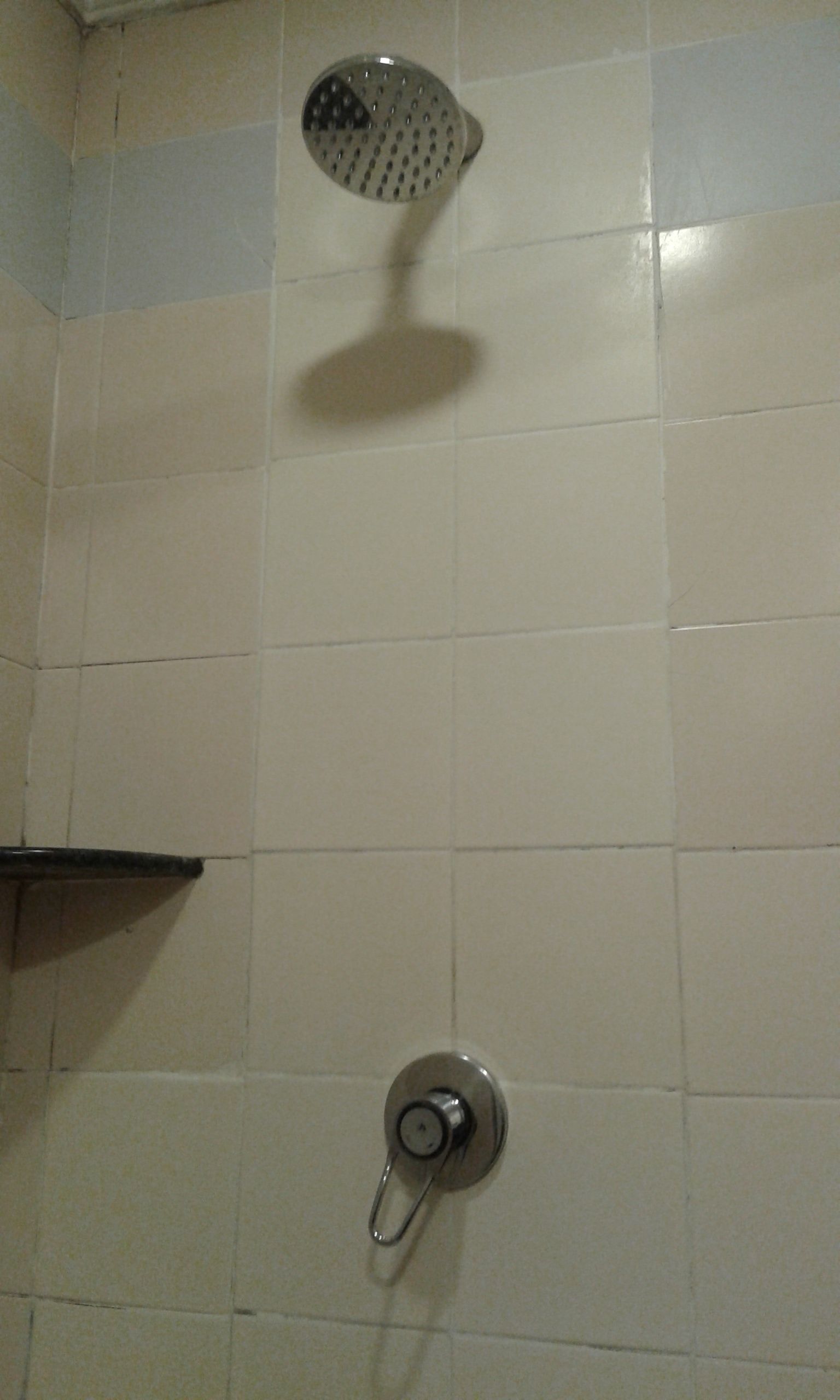 shower, hair dryer, slippers, towels