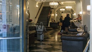 A hotel lobby with a checkered floor, a staircase, and a reception desk. - The Gin Hotel, an Ascend Collection Hotel (Lexington)