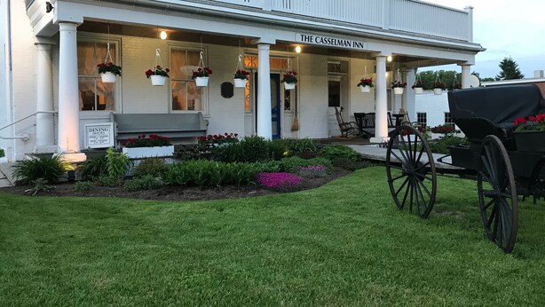 A white building with a sign reading "The Casselman Inn."