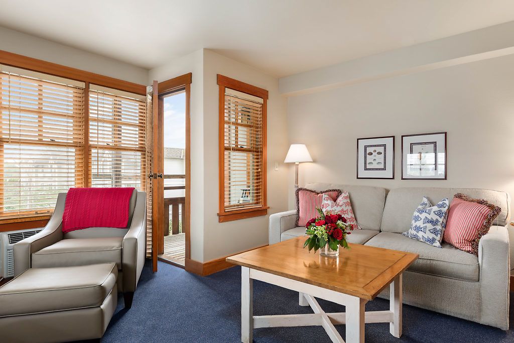 king suite with jetted tub non view | living room | flat-screen tv, fireplace, dvd player, video library