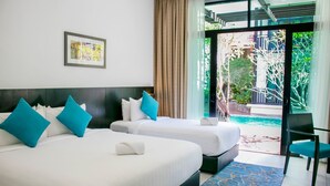 A hotel room with two beds, a large window, and a view of a swimming pool. - Espira Kinrara (Puchong)
