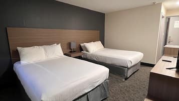Hypo-allergenic bedding, desk, laptop workspace, blackout curtains