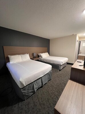 Hypo-allergenic bedding, desk, laptop workspace, blackout drapes