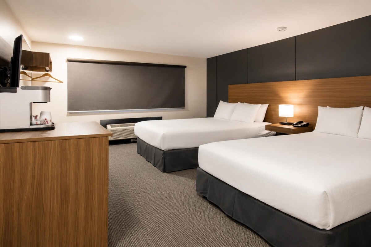 Hypo-allergenic bedding, desk, laptop workspace, blackout curtains
