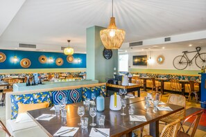 Breakfast, lunch, dinner served; local cuisine 