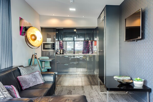 Penthouse Suite | Living area | Flat-screen TV