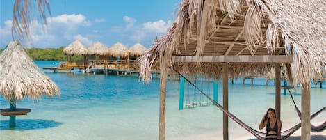 Private beach, white sand, free beach cabanas, sun loungers