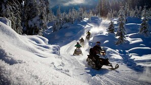 A snowmobile trail in a snowy forest. - Algonquin Motel (Machar)