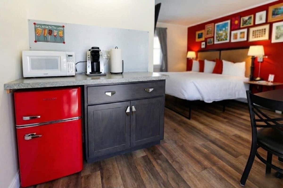 Individually decorated, desk, blackout drapes, iron/ironing board