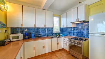 Moonlight, 2 Bedroom Apartment | Private kitchen | Full-size fridge, microwave, oven, stovetop